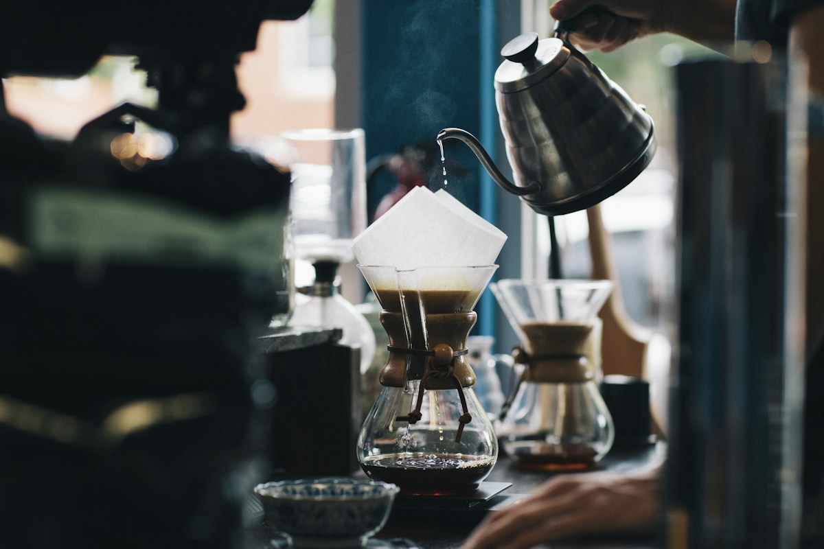 Pour-over coffee being prepared at a café counter